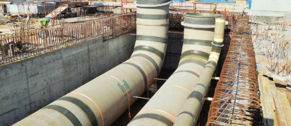 GRP pipe bends installed in a reinforced concrete chamber